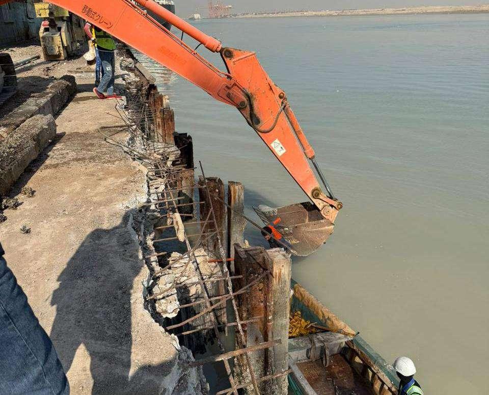 Excavator working on berth repair at Umm Qasr